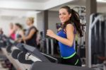 Woman Running On Treadmill Stock Photo