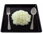 Rice In Black Plate Stock Photo