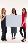 Three Female College Career Students With A Serious Message Stock Photo