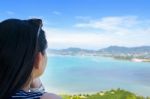 Woman Tourist Watching The Ocean In Phuket, Thailand Stock Photo