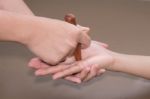 Reflexology Hand  Massage,thai Spa Massage  Treatment With Wood Stick Isolate Stock Photo