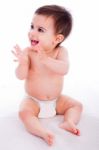 Cute Baby Sitting And Enjoying Stock Photo