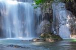 The Water Flowing Over Rocks And Trees Down A Waterfall At Huay Mae Khamin Waterfall National Park ,kanchana Buri In Thailand Stock Photo