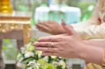 Hands Pouring Blessing Water Into Bride's Hands Stock Photo