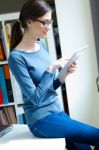 Young Worker Woman With Digital Tablet In Her Office Stock Photo
