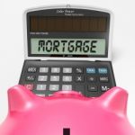 Mortgage Calculator Shows Purchase Of Real Estate Stock Photo