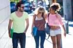 Students Group Talking And Laughing In The Street Stock Photo