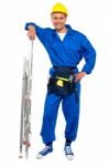 Smiling Builder With Step Ladder Stock Photo