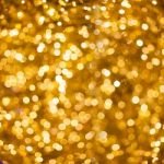 Defocused Golden Abstract Christmas Background With Bokeh Effect Stock Photo