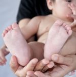 Baby S Foot In Mother S Hand Stock Photo