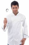 Young Chef Holding Slotted Spoon Stock Photo