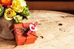 Gifts And Bouquets On Wooden Stock Photo