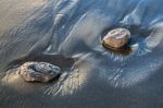 Two Rocks In Volcanic Sand Stock Photo