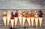 Concept For Homemade Various Nuts Ice Cream. Mixed Nuts In Waffl Stock Photo