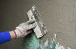 Hand With A Trowel Plaster Wall Stock Photo