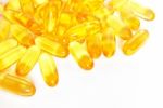 Shiny Yellow Fish Oil Capsule Pills Closeup Stock Photo
