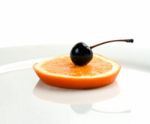 Orange&cherry On A Plate Stock Photo
