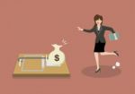 Business Woman Try To Pick Money From Mousetrap Stock Photo