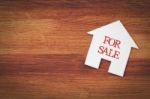 House For Sale Symbol With Wood Background Stock Photo