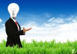 Businessman With Lamp Head Stock Photo