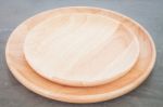 Wooden Plate On Grey Background Stock Photo
