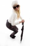 Side View Of Happy Female Holding An Umbrella Stock Photo