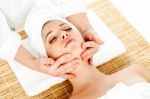 Woman Getting Face Massage During Spa Stock Photo