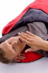 Man Yawning In Sleeping Bag Stock Photo