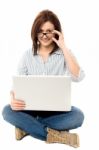 Pretty Woman Browsing On Laptop Stock Photo