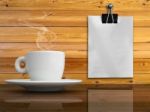 A White Cup Of Coffee And White Paper Stock Photo