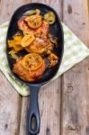 Delicious Baked Chicken Thighs With Lemon Slices, Onion And Zucchini Stock Photo