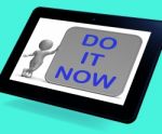 Do It Now Tablet Shows Encouraging Immediate Action Stock Photo