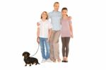 Mother Son Daughter Standing And Smiling With Small Dog Stock Photo