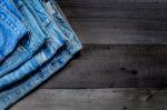 Blue Jean And Jean Lack Texture On The Wooden Floor Stock Photo