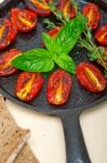 Baked Cherry Tomatoes With Basil Anf Thyme Stock Photo
