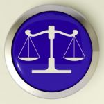 Scales Of Justice Button Means Law Trial Stock Photo