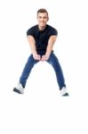 Happy Man Jumping In Air Stock Photo