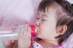 Cute Little Asian (thai) Girl Sleeping And Suck Up Milk Stock Photo
