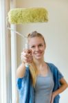 Young Beautiful Woman Painting Hew New Home Stock Photo