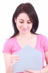 Young Woman Opening A Letter Stock Photo