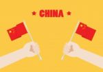 Hands Holding Up China Flags Stock Photo