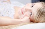Cute Blond Girl On Pillow Stock Photo