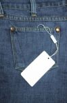 Label Tied With Blue Jeans Stock Photo
