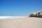 Small Cliff At A Beautiful Beach In Praia Del Rey Stock Photo