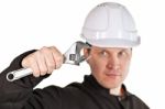 Handyman Wearing Uniform And Hardhat Stock Photo