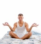 Young Man In Yoga Lotus Pose Stock Photo