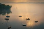 Yachts In The Early Morning Mist At Lesa Lake Maggiore Piedmont Stock Photo