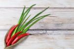 Red Hot Chilli Pepper And Green Onion Stock Photo