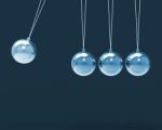 Four Silver Newtons Cradle Shows Blank Spheres Stock Photo