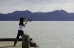 Fisherman Fishing Trolling In The Sea Stock Photo